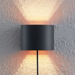 Arcchio vegglampe Zuzana, rund, svart, støpsel, 13 cm