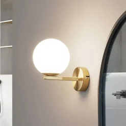 Lucande vegglampe Bidolo, messingfarget, glass, 12 cm, IP44